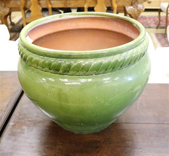 A green glazed garden planter, 44cm diameter